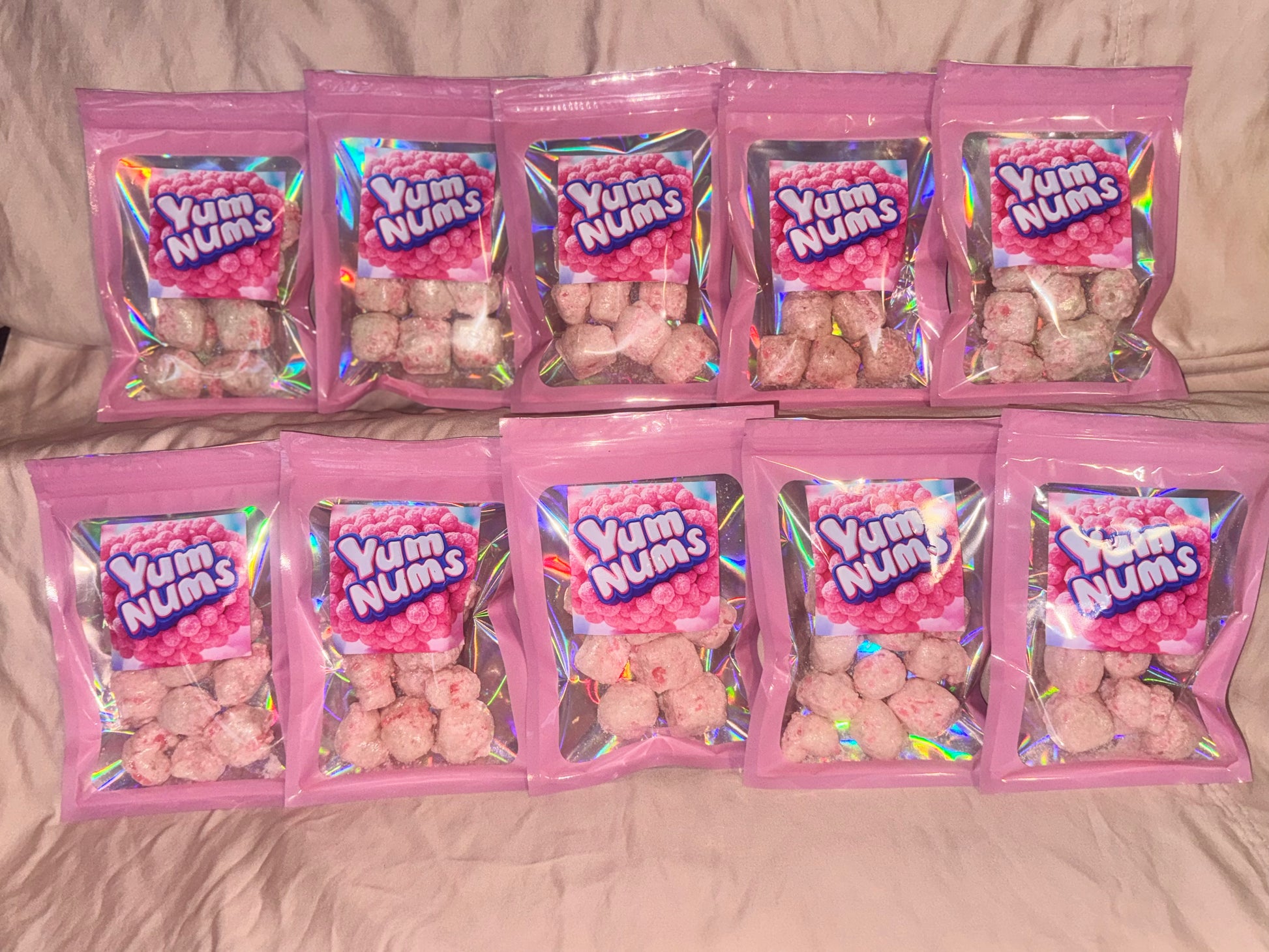 Ten bags of Watermelon YumNums Freeze-Dried Candy, featuring a stack of crunchy, juicy watermelon-flavored snacks, ideal for bulk snacking or sharing.
